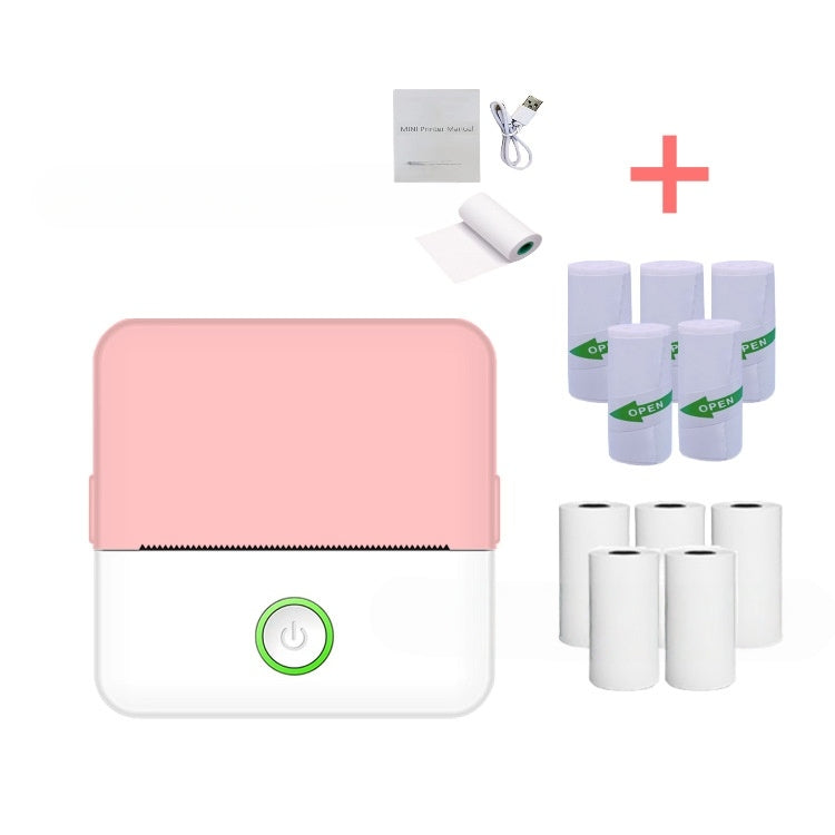 Pink printer with supplies on a white background