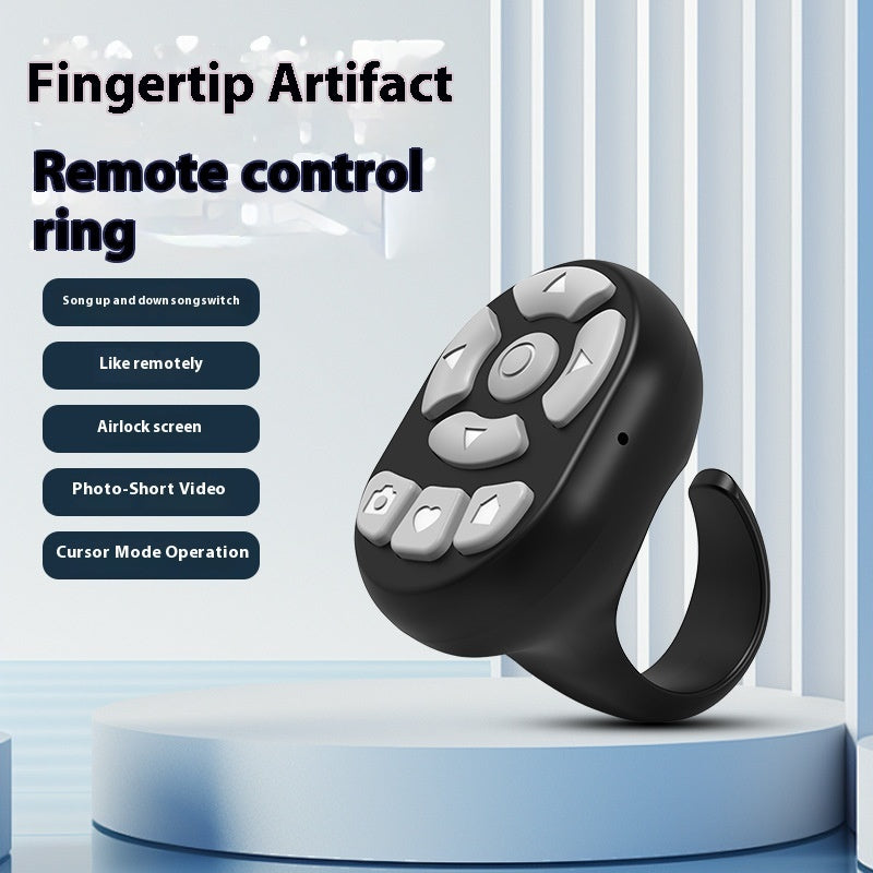 Black remote control ring with gray buttons on a white background