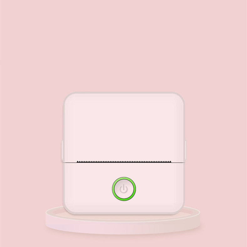 White electronic device with a green power symbol on a pink background