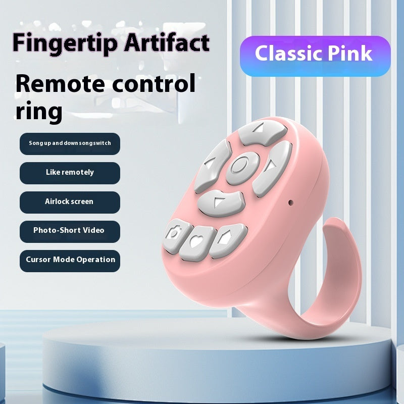 Pink remote control ring with buttons on a light blue background